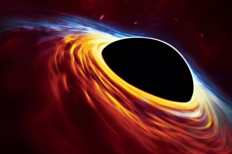 Rappresentazione artistica di un buco nero circondato dal su disco di accrescimento (fonte: ESO, ESA/Hubble, M. Kornmesser) - RIPRODUZIONE RISERVATA